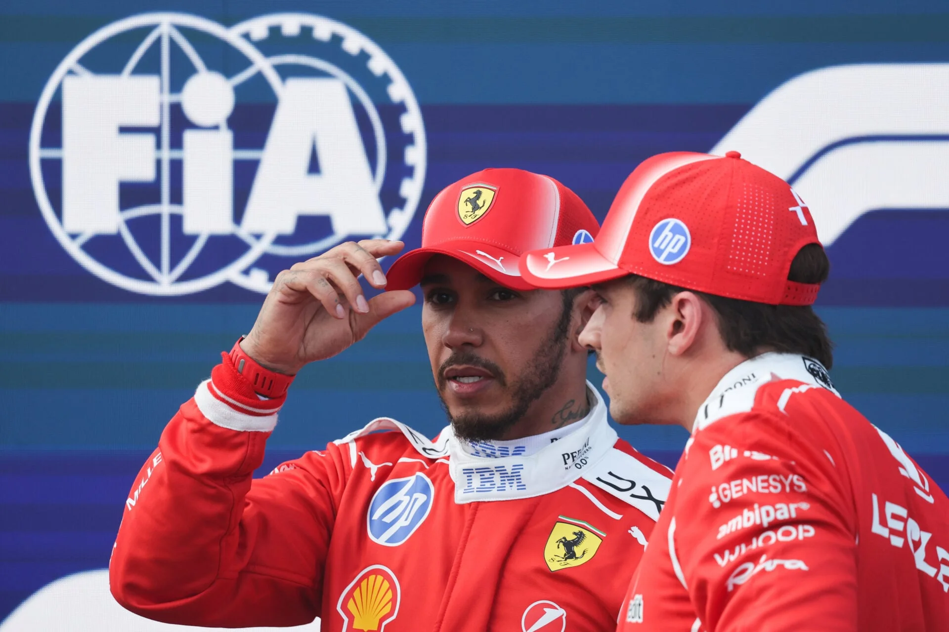 Charles Leclerc and Lewis Hamilton of Ferrari after practice at the Hungarian Grand Prix.